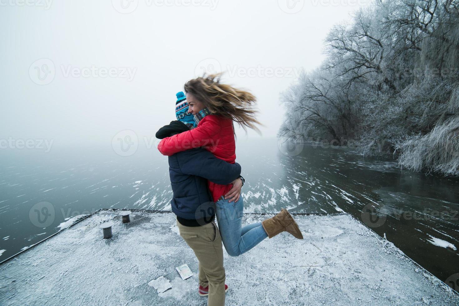 Couple in winter landscape photo