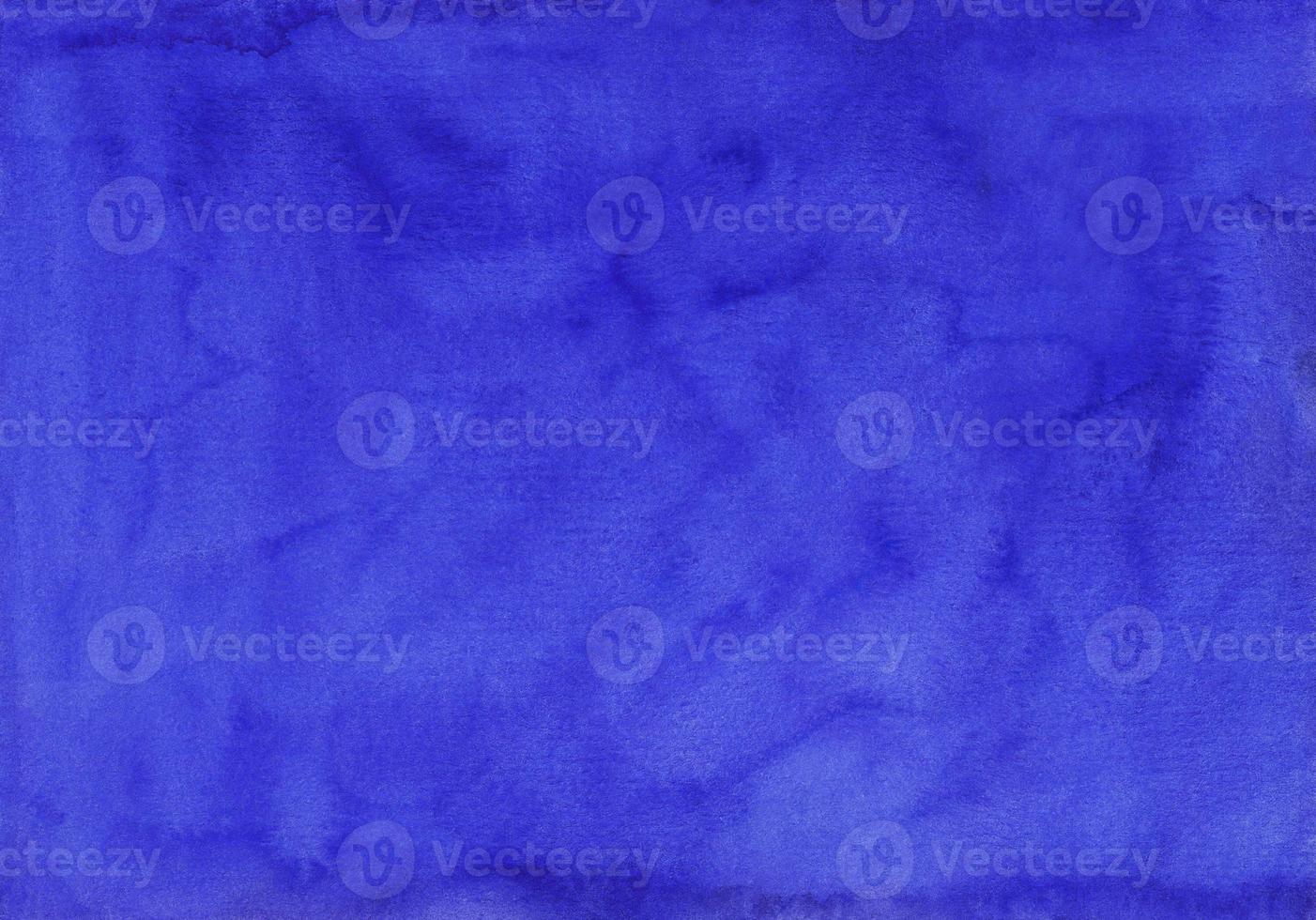 Watercolor deep royal blue background texture hand painted. Aquarelle blue stains on paper. photo