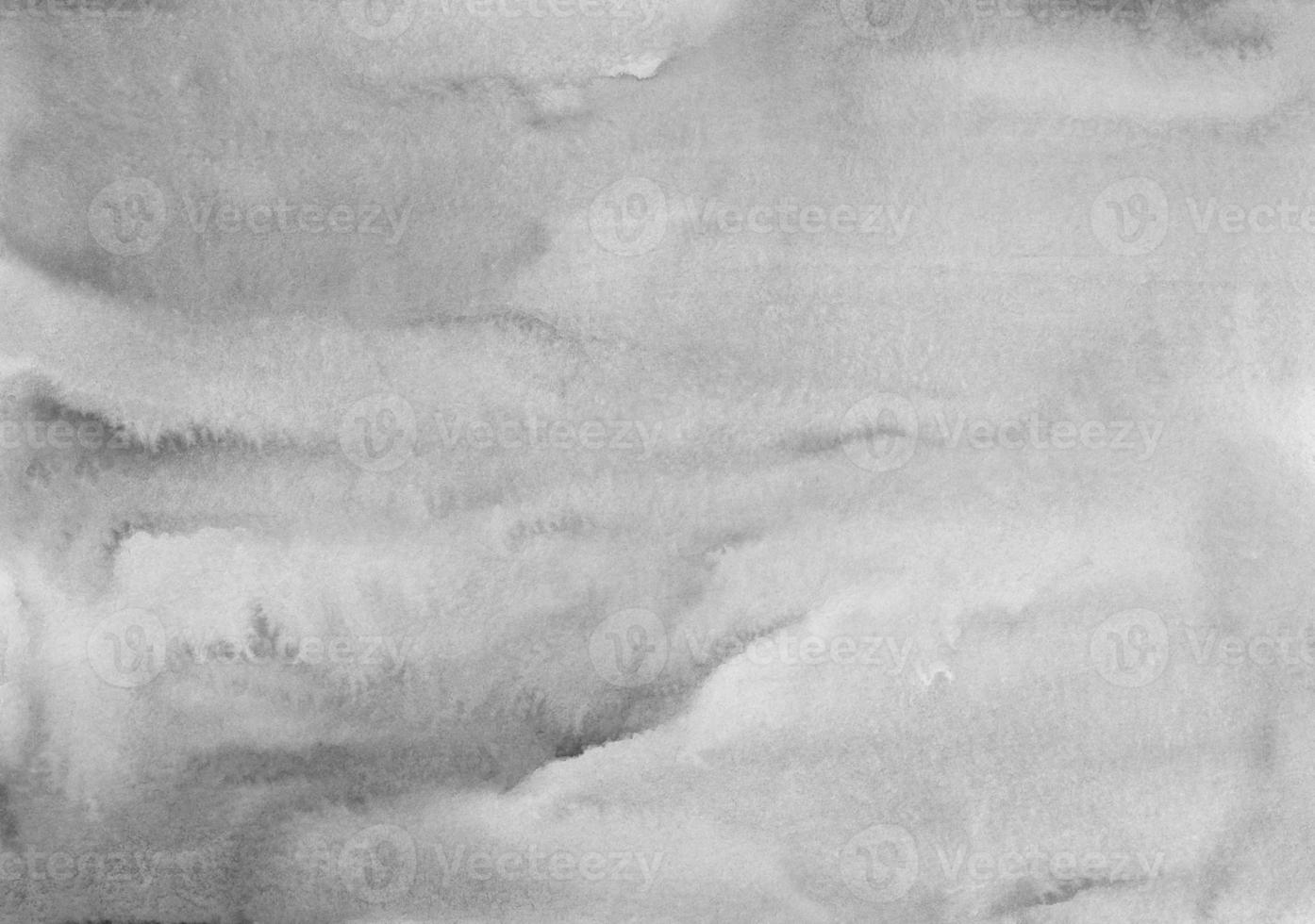 Watercolor calm gray stains on paper background texture. Monochrome  backdrop overlay. Abstract aquarelle black and white modern painting. photo