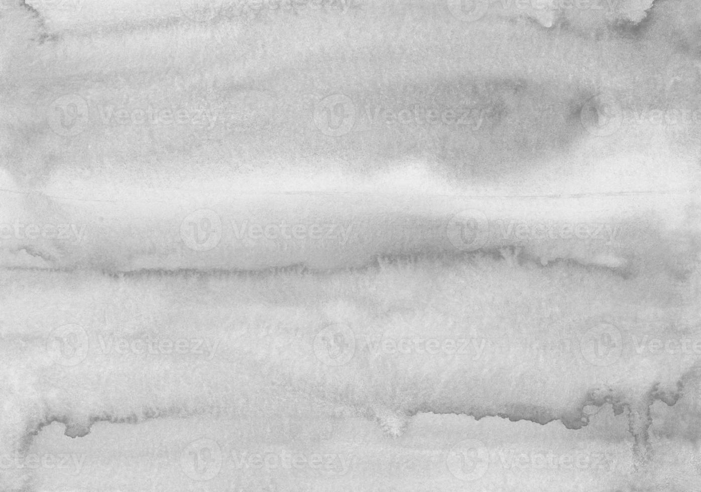 Watercolor light gray stains on paper background texture. Monochrome  backdrop overlay. Abstract aquarelle black and white modern painting. photo