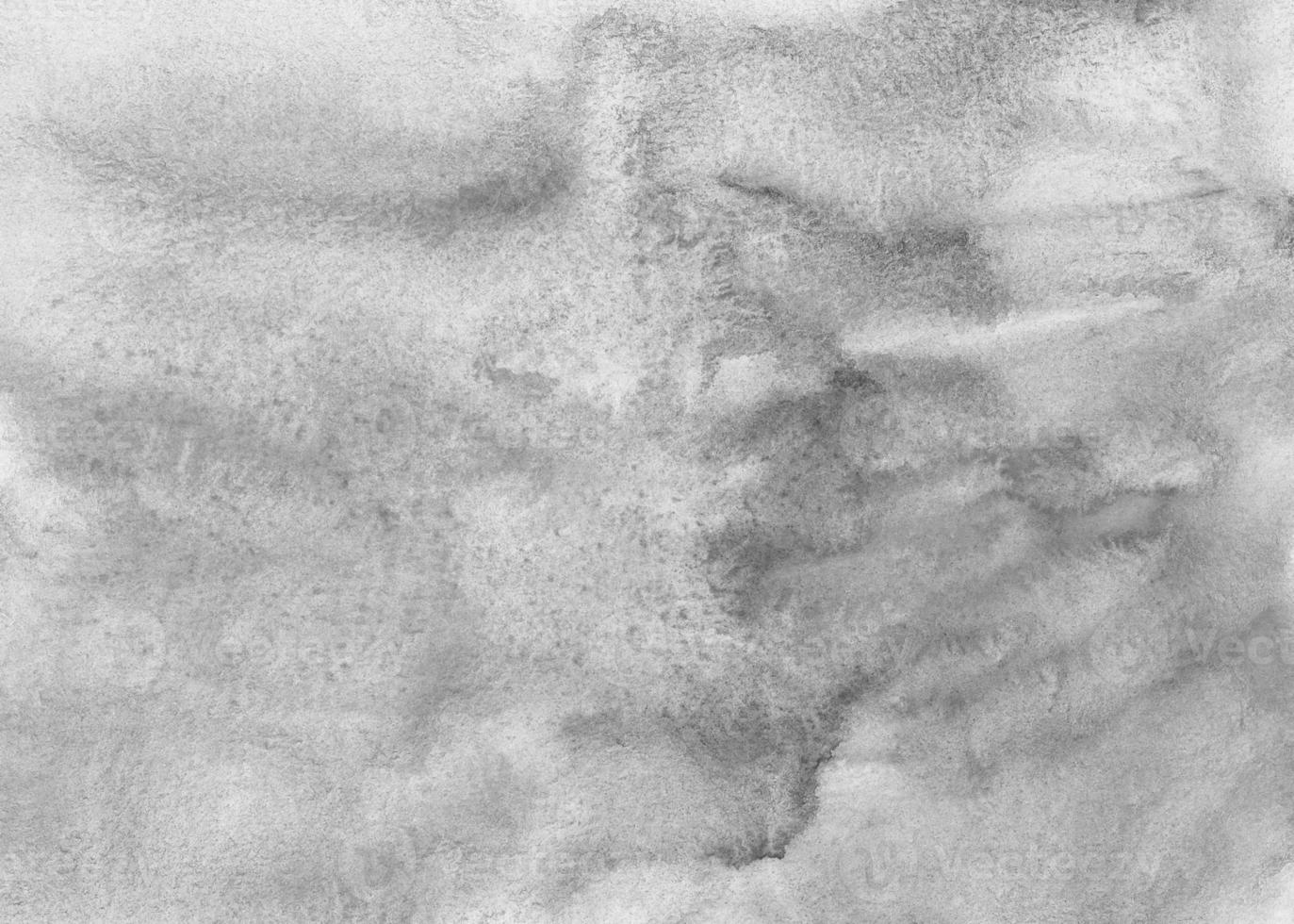 Watercolor light gray background texture. Stains on paper watery backdrop. White and grey overlay. photo