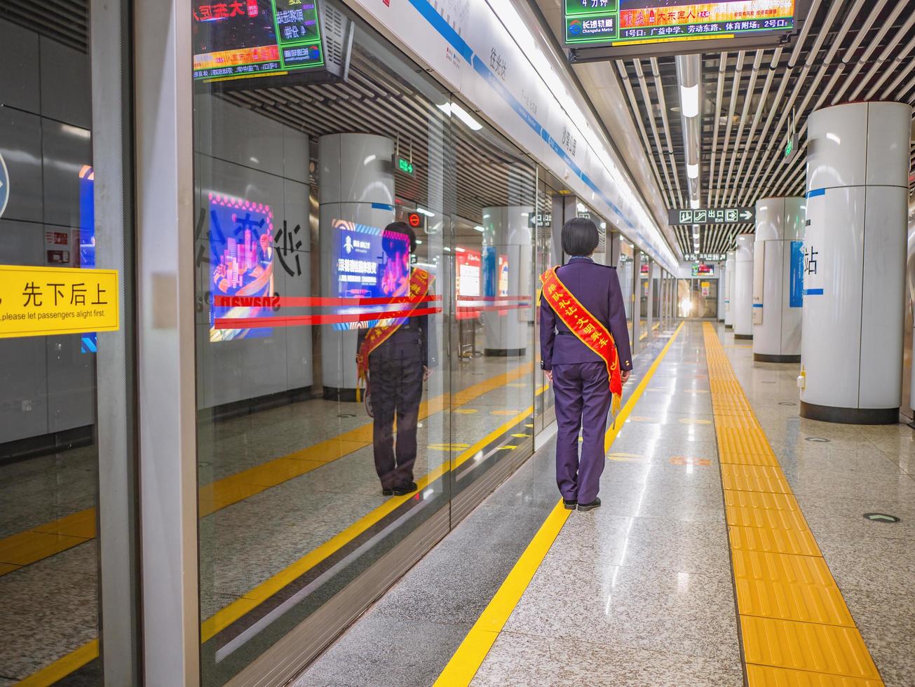 Changsha.China-17 October 2018.Unacquainted Chinese Staff in Changsha Subway platform at Changsha south Station hunan province China. photo