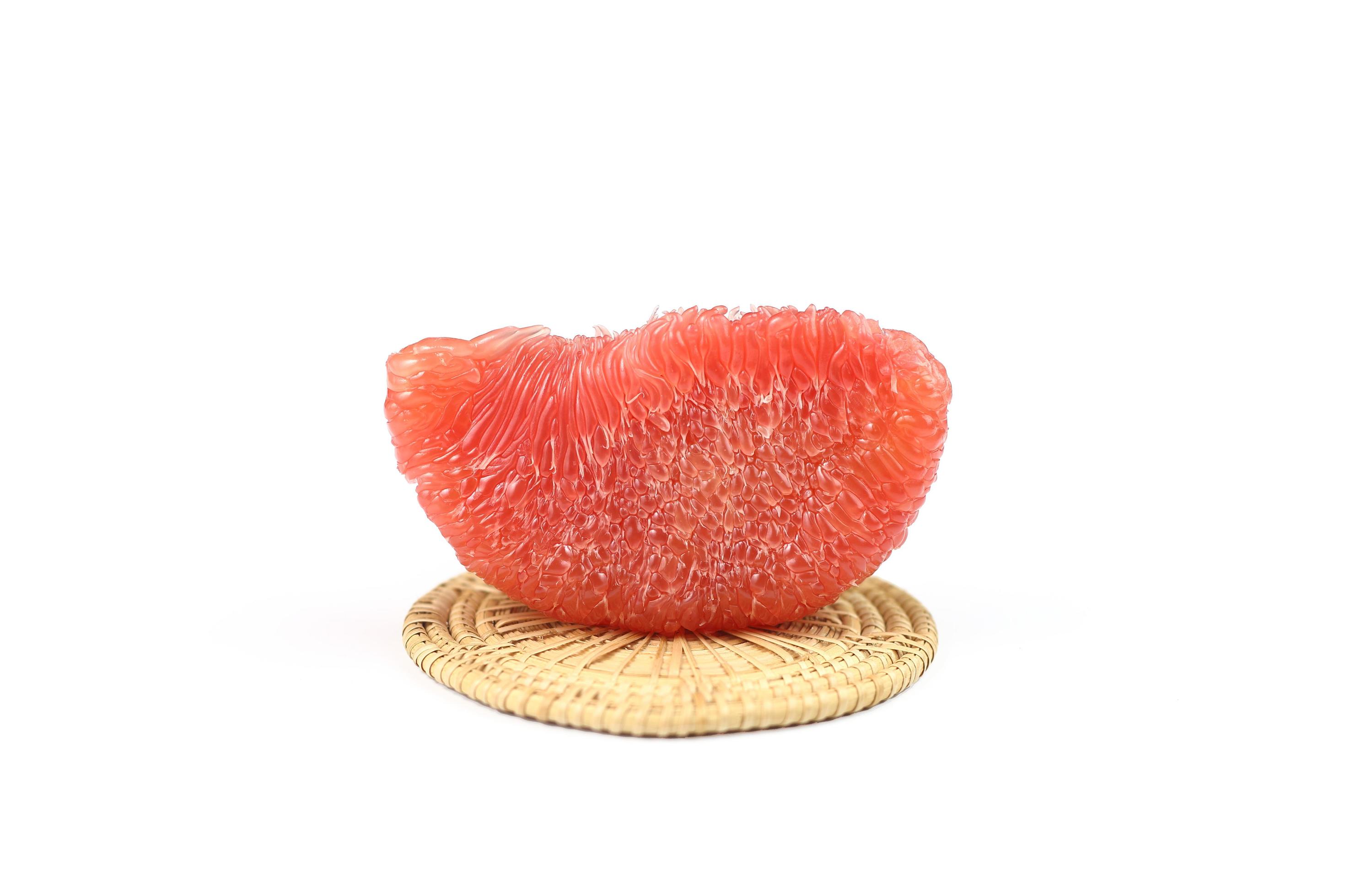 Piece of ripe red siam ruby pomelo , pummelo, grapefruit with no peel
