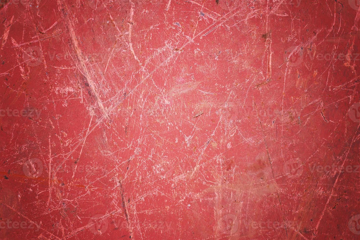 Scratch blank red grunge metal  surface as dark texture background with spot and vignette border. photo