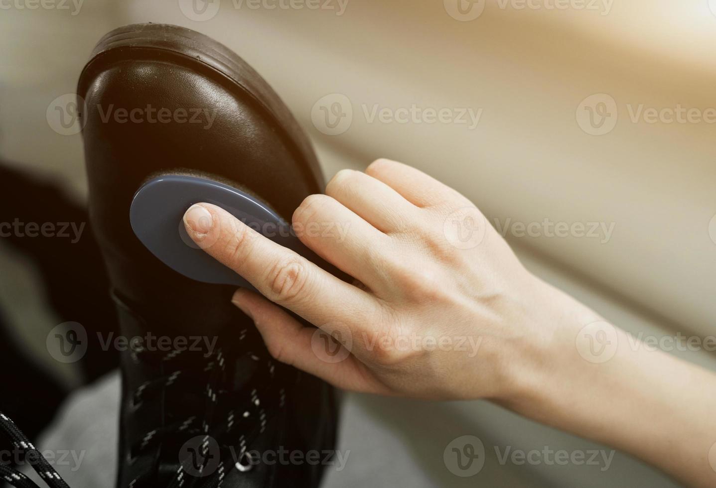 rubbing leather shoes photo