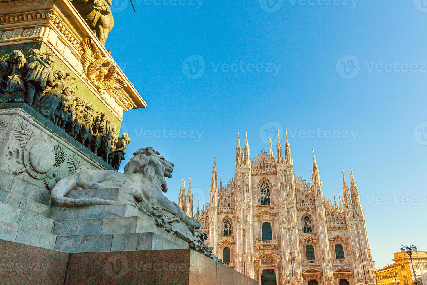 Lion marble statue near famous church Milan Cathedral Duomo di Milano. Panoramic view of top tourist attraction on piazza in Milan Lombardia Italy. Wide angle view of old Gothic architecture and art. photo