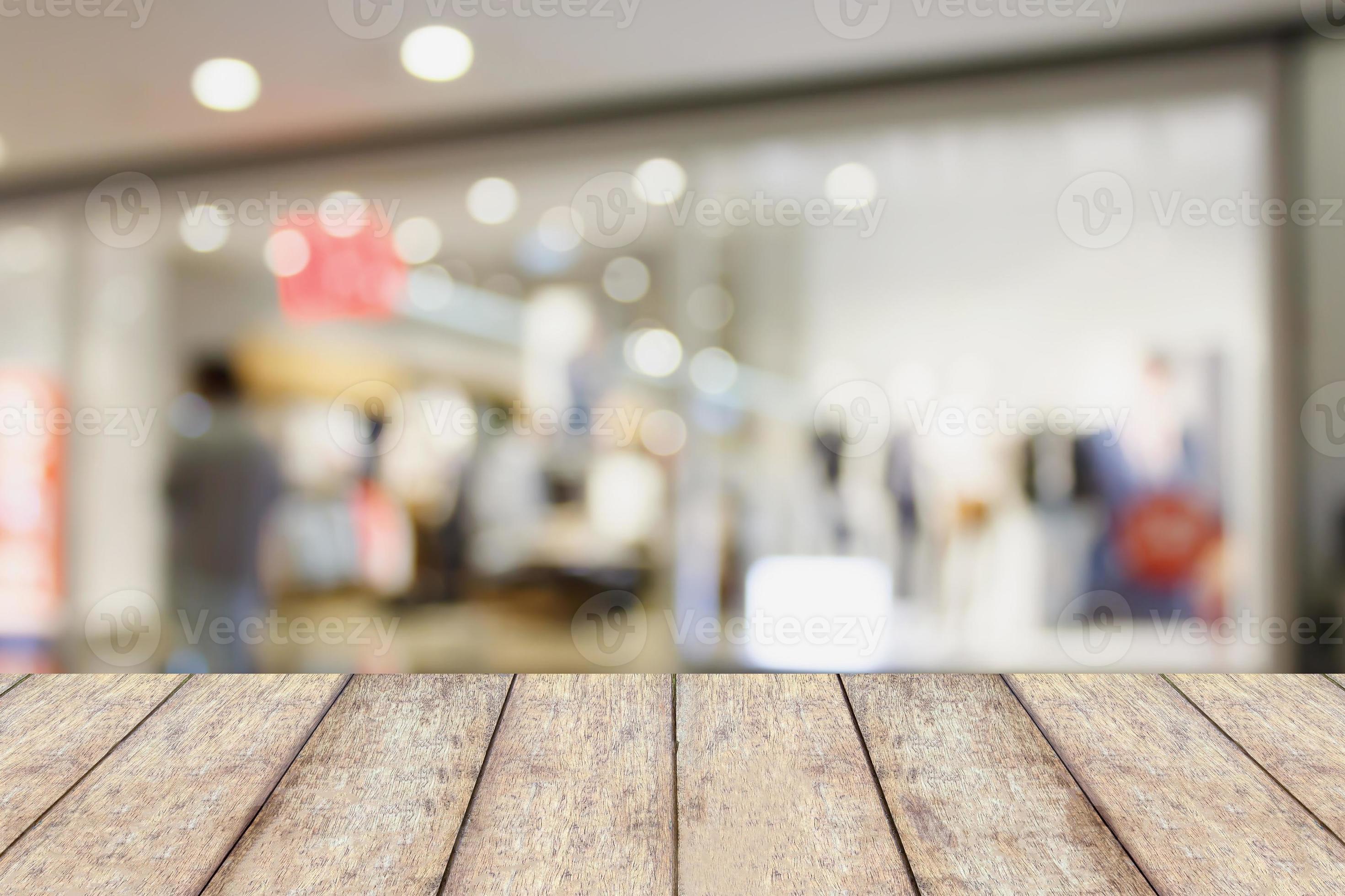 wood table with shopping mall store blurred background 12566937 Stock