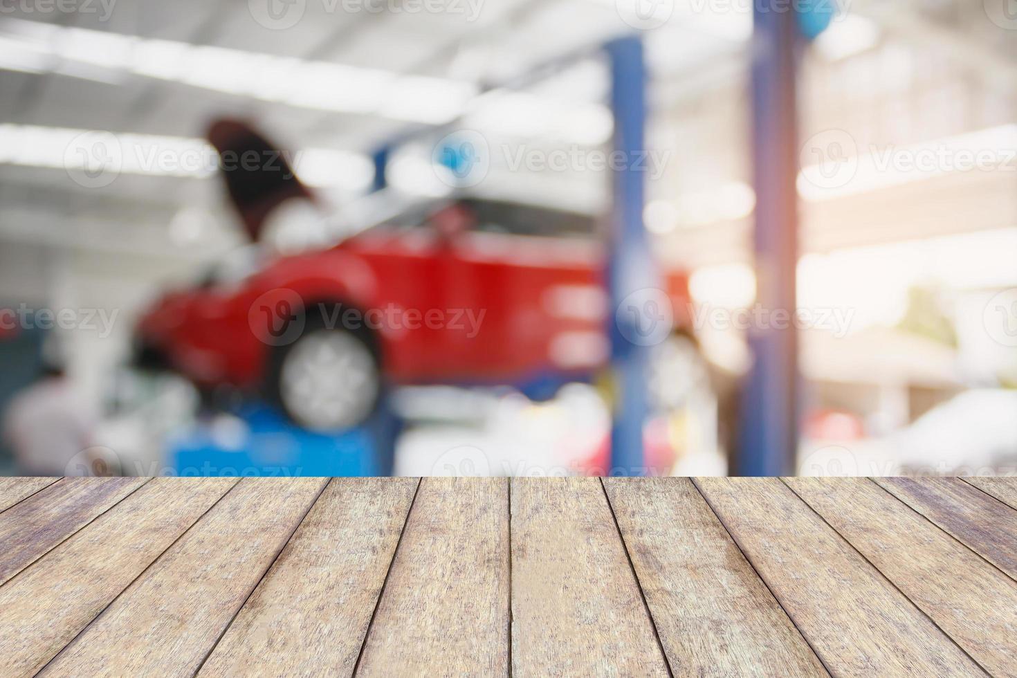 Wood table top with blur car service centre background photo