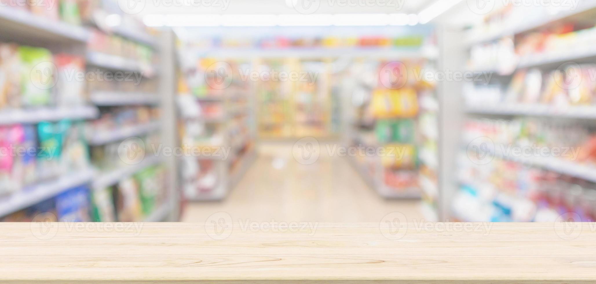 Empty Wood table top with supermarket grocery store blurred defocused background with bokeh light for montage product display photo