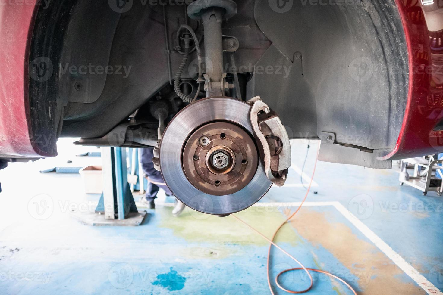 Close up disc brake at car service workshop photo