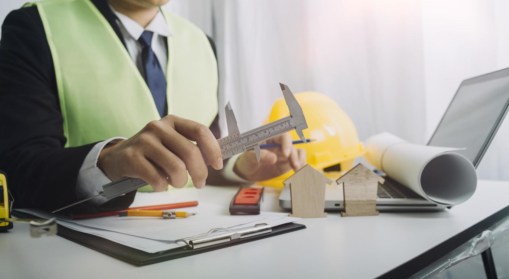 Scene of industrial engineers discussion, Construction architect with huge industry as a background, Concept of engineer project planning, professional teamwork. Selective focused. photo