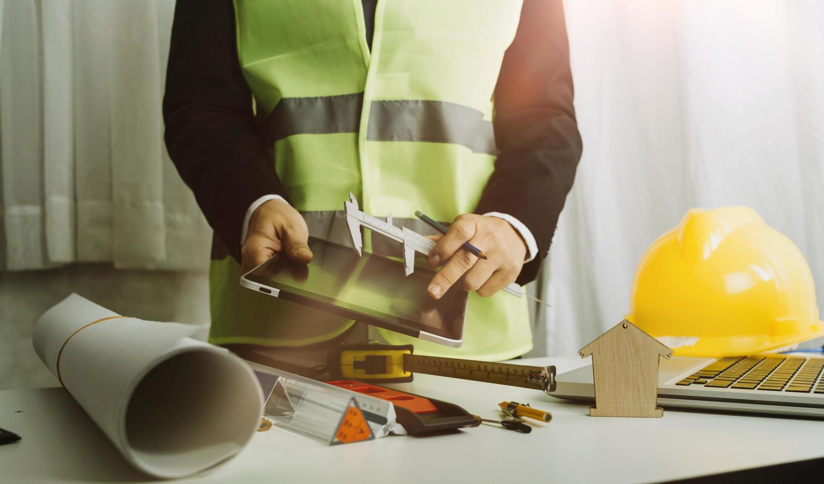 Scene of industrial engineers discussion, Construction architect with huge industry as a background, Concept of engineer project planning, professional teamwork. Selective focused. photo