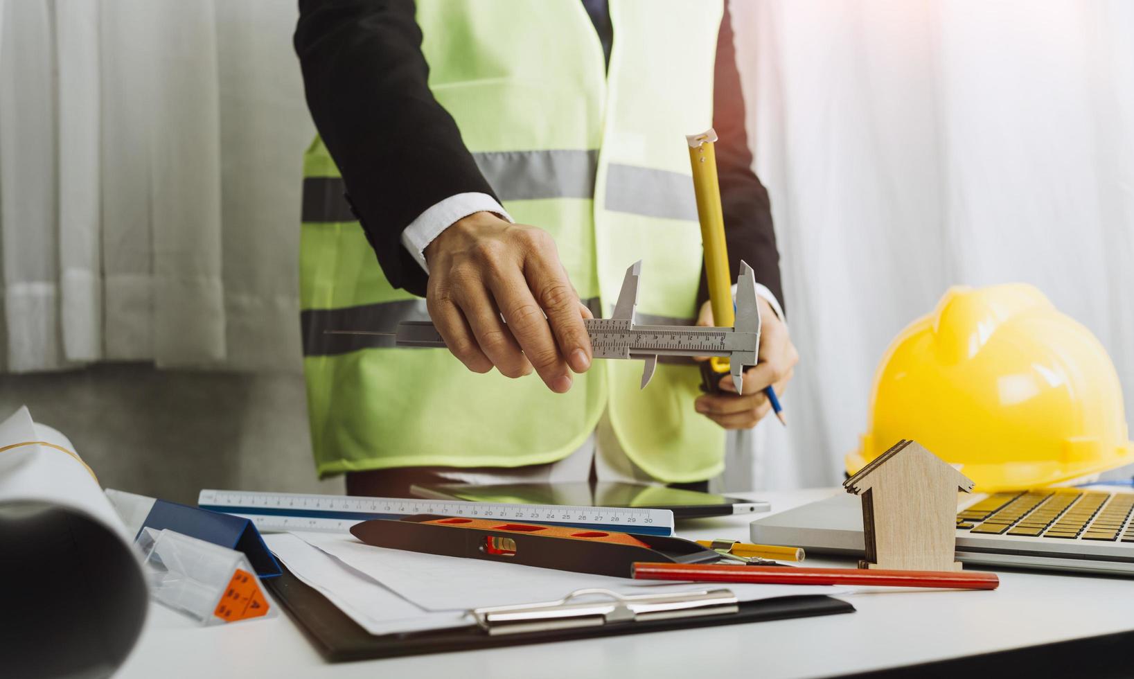 Scene of industrial engineers discussion, Construction architect with huge industry as a background, Concept of engineer project planning, professional teamwork. Selective focused. photo