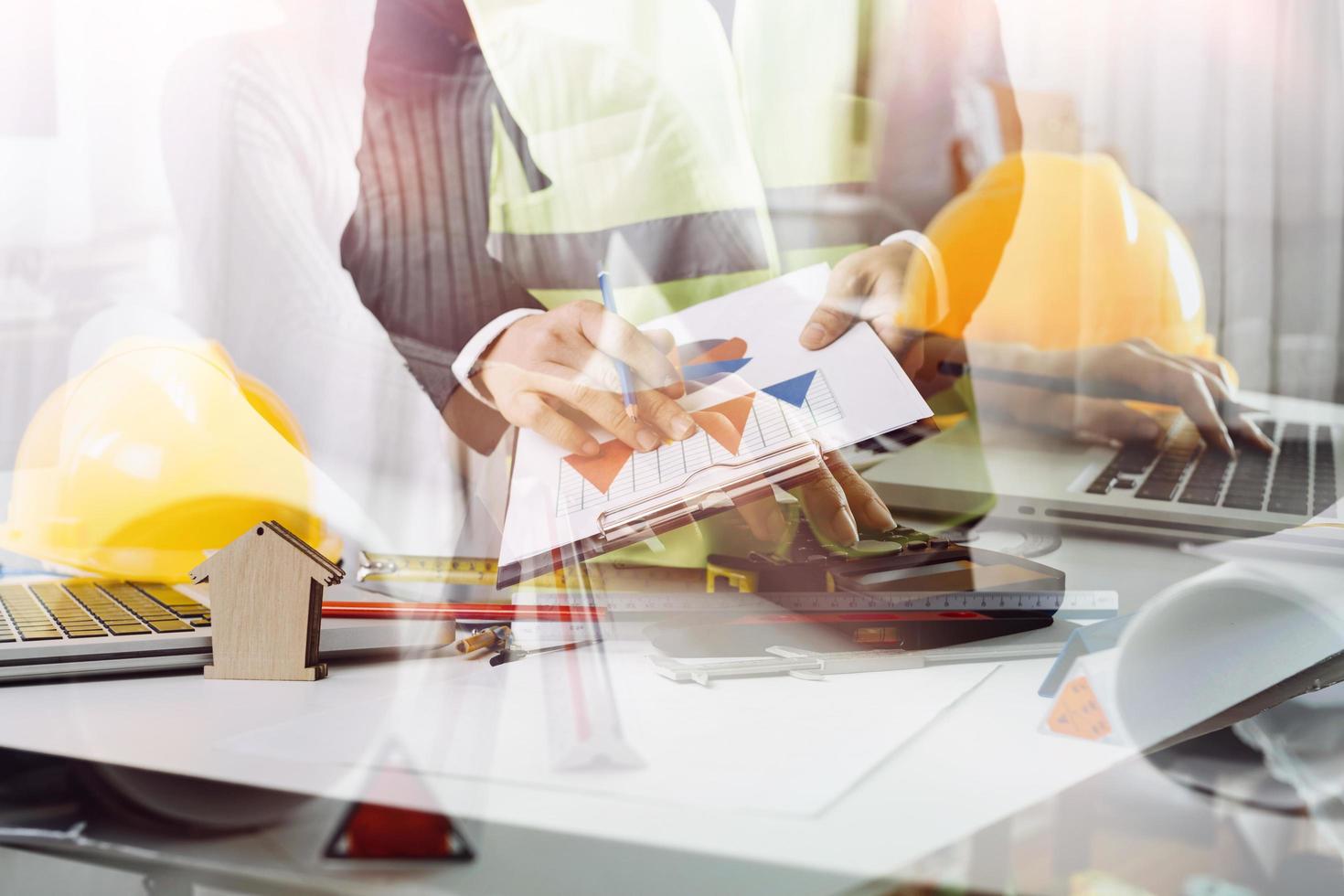 Scene of industrial engineers discussion, Construction architect with huge industry as a background, Concept of engineer project planning, professional teamwork. Selective focused. photo