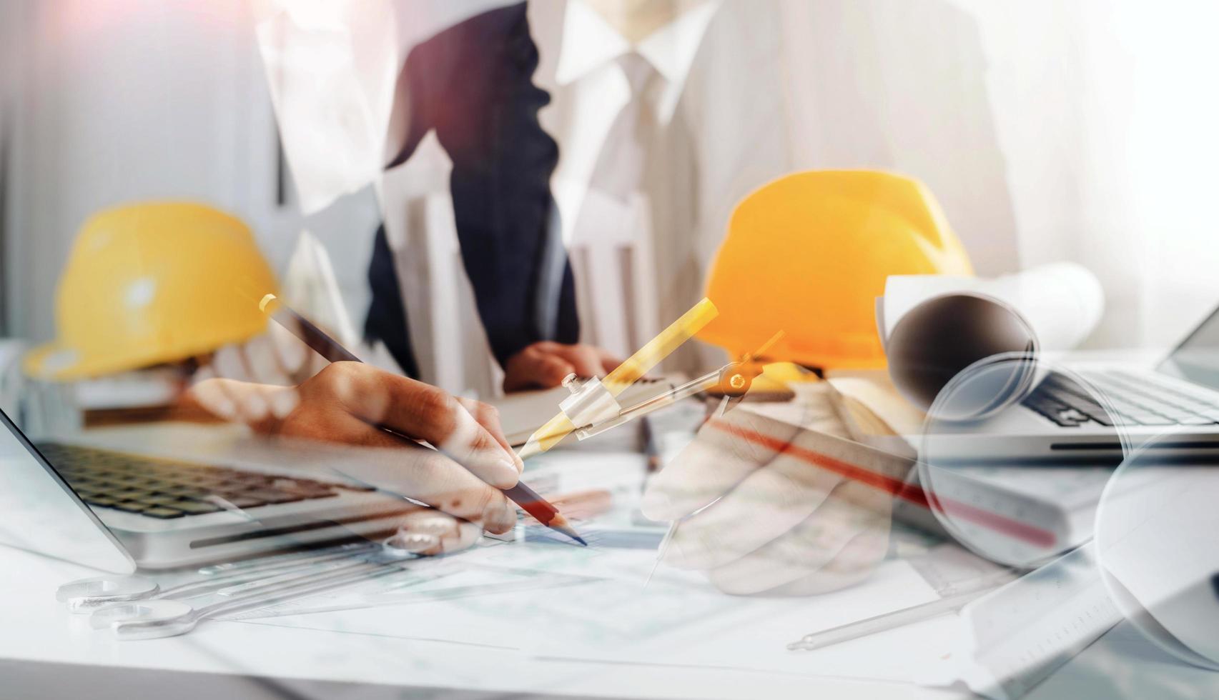 Scene of industrial engineers discussion, Construction architect with huge industry as a background, Concept of engineer project planning, professional teamwork. Selective focused. photo