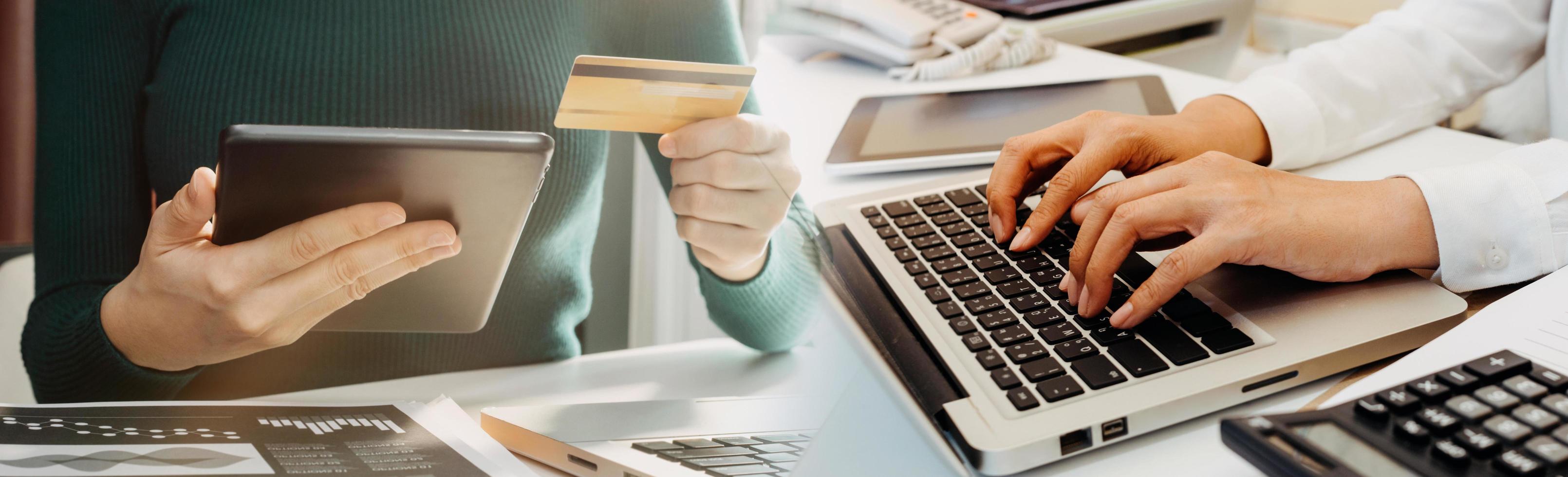 technology, people and online shopping concept - happy smiling man with tablet pc computer and credit card at home photo