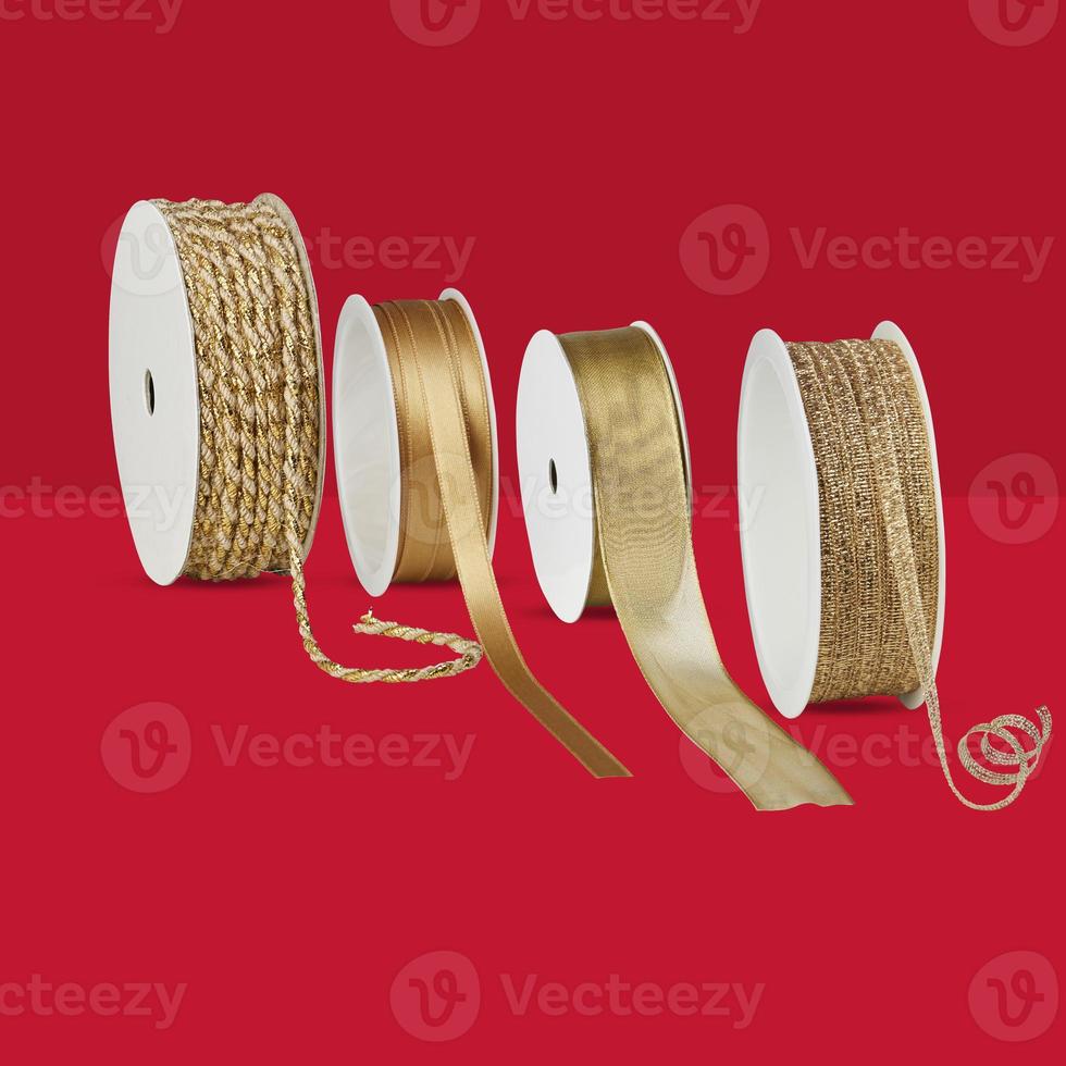 ribbons christmas gift wrapping isolated on red background with clipping path photo