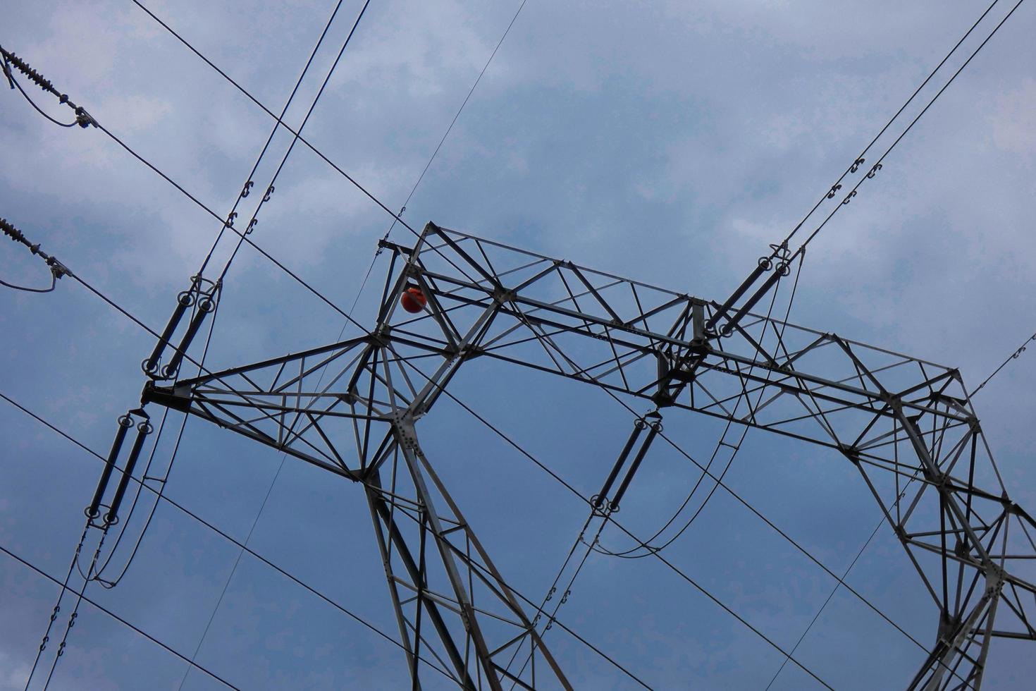 Electric towers supporting the copper cables that transmit and transport electricity photo