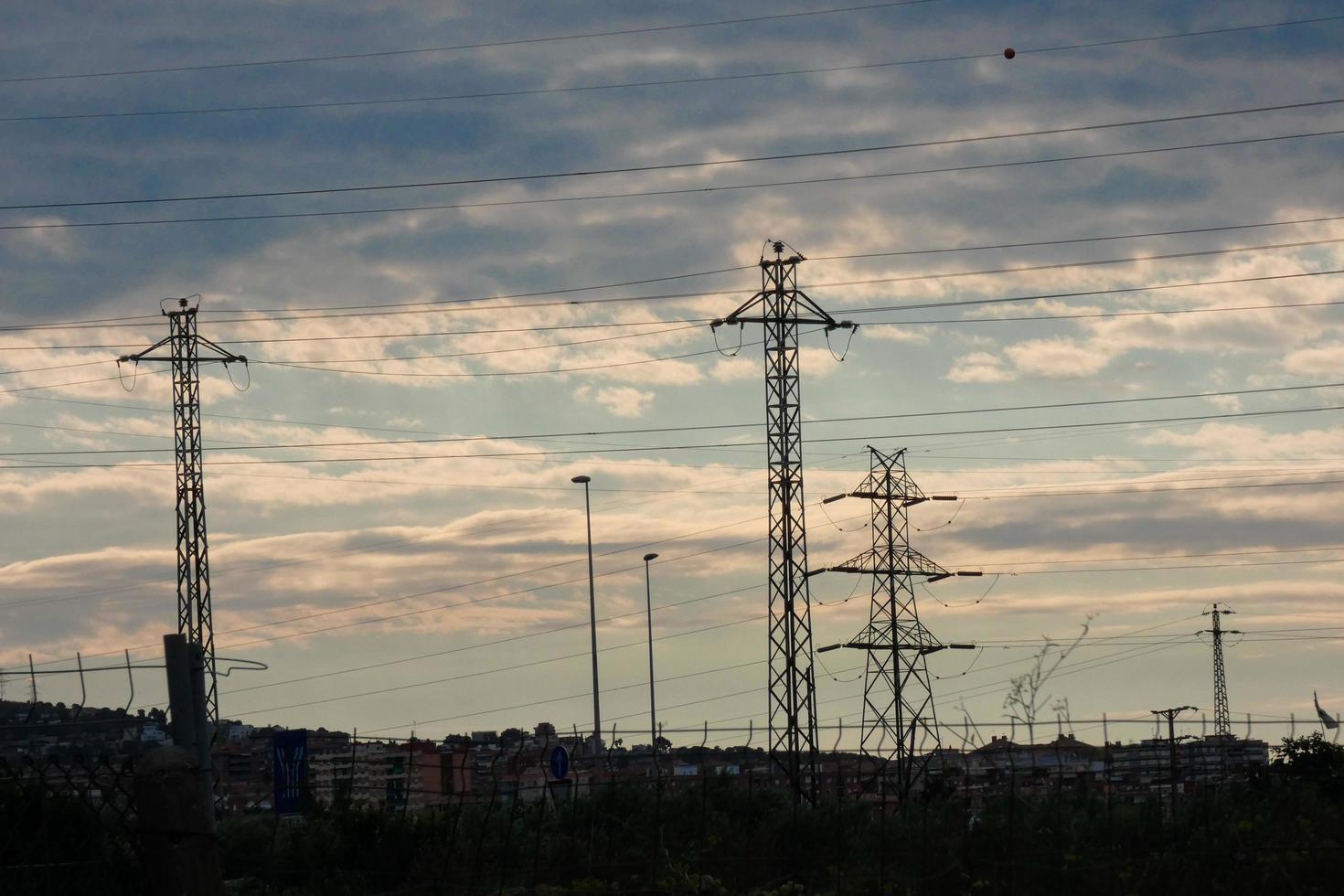 Electric towers supporting the copper cables that transmit and transport electricity photo