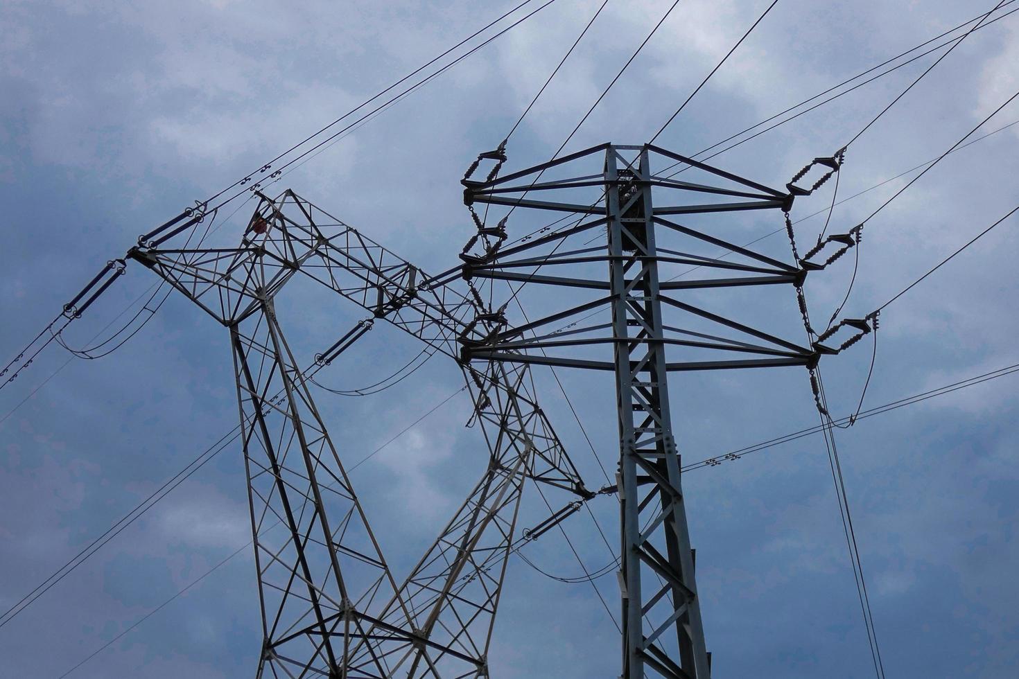 Electric towers supporting the copper cables that transmit and transport electricity photo