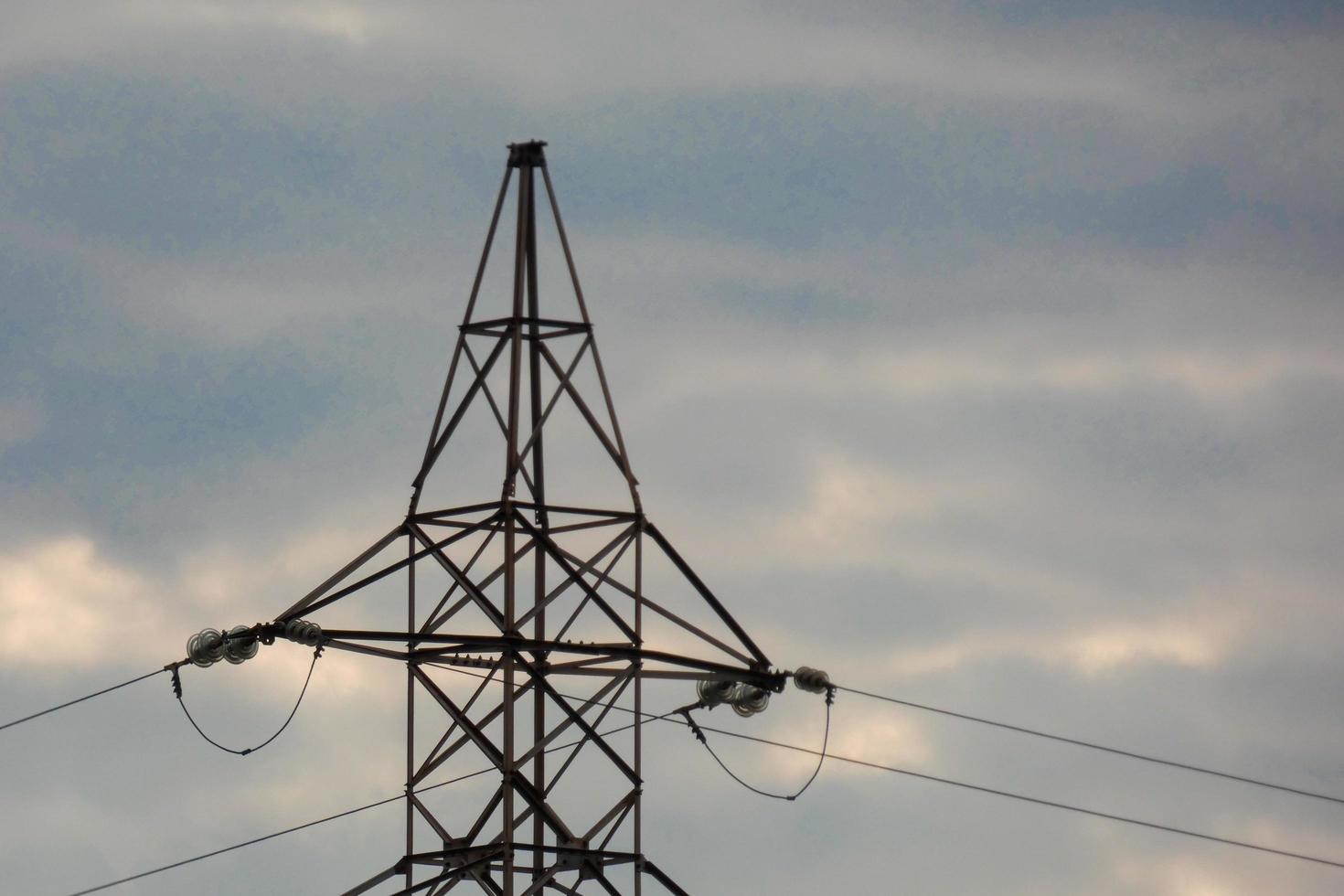 Electric towers supporting the copper cables that transmit and transport electricity photo