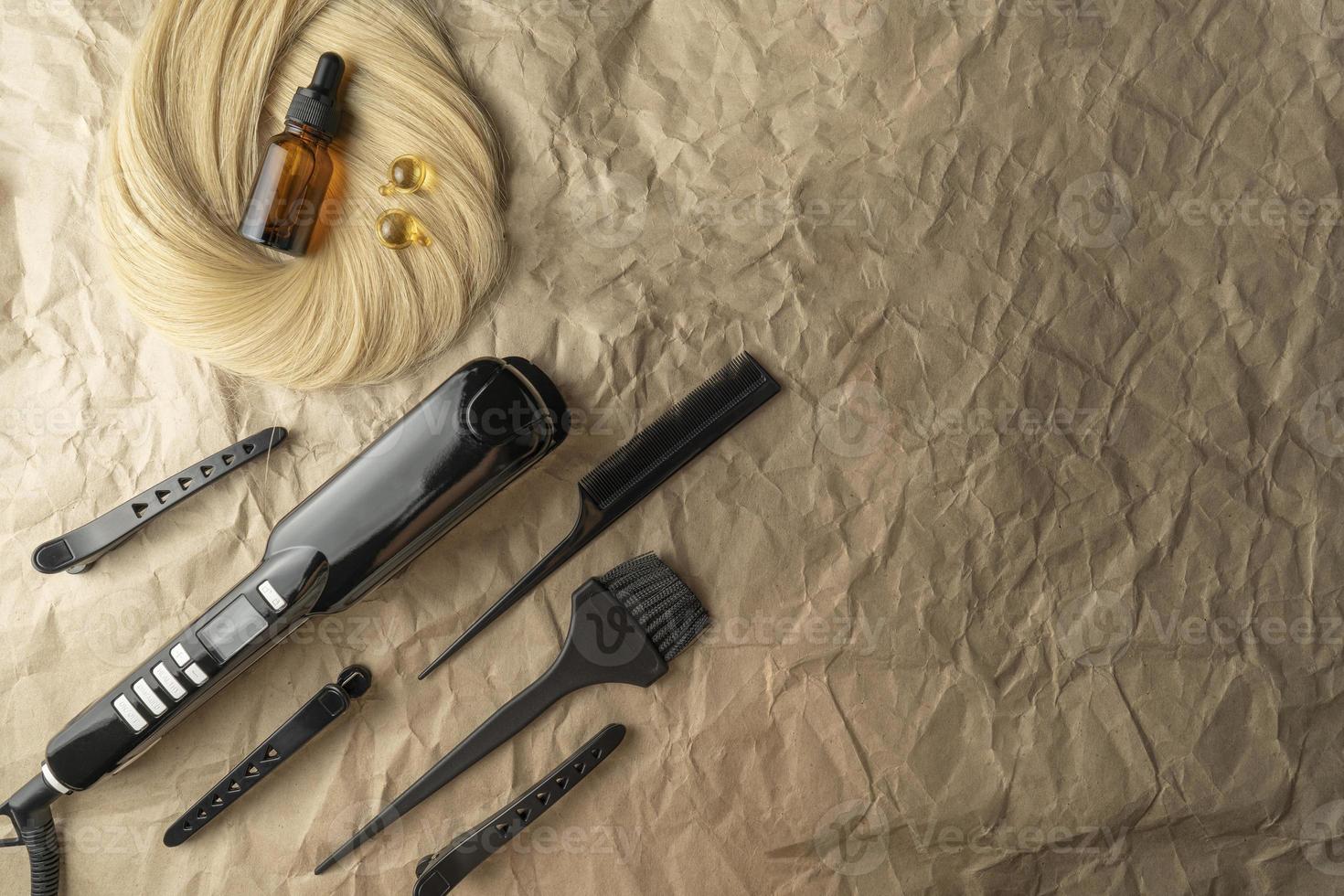 Instruments for salon hair care procedures lying on a brown craft paper photo