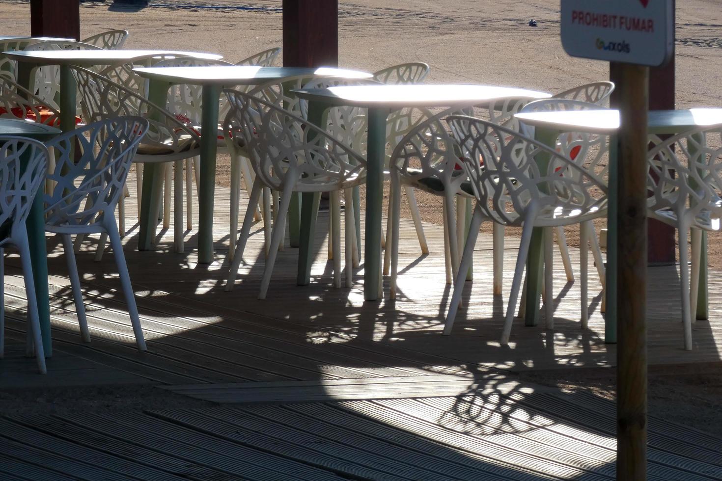White metal tables and chairs for outdoor and garden use photo