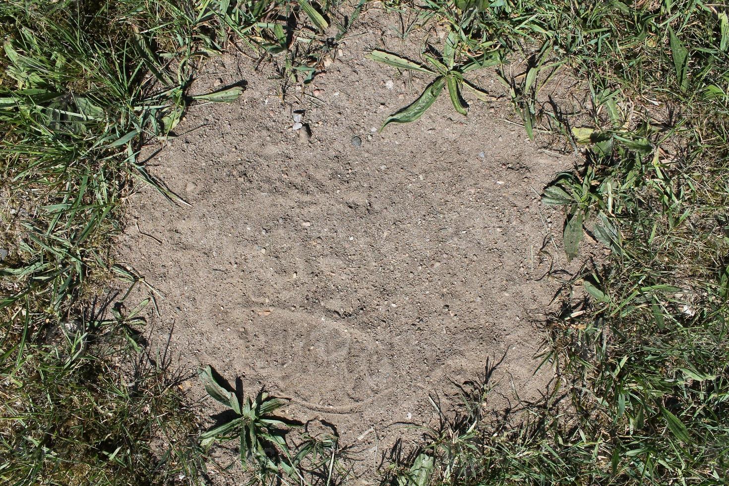 Detailed close up view on a brown sand ground texture photo