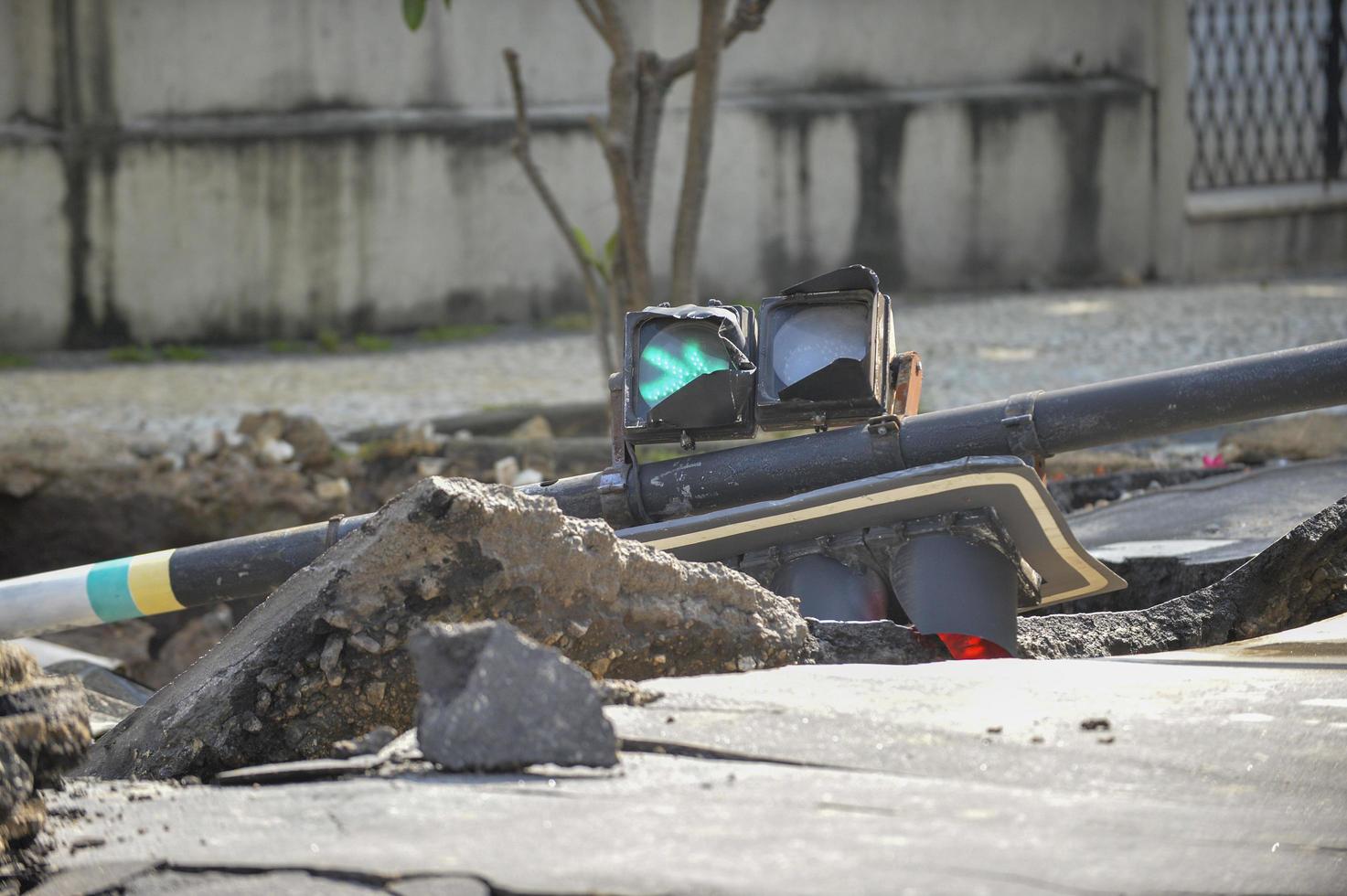 Rio de Janeiro, Brazil - march 02, 2018 -   backhoe works in the removal of a car that has fallen into a hole, caused by leakage of water pipe photo