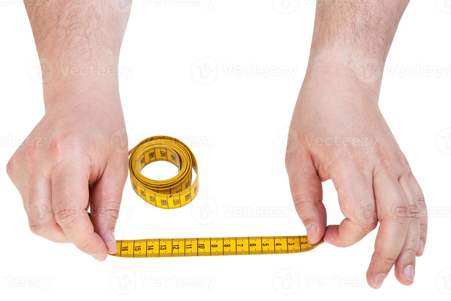 male hands with tailor measuring tape isolated photo