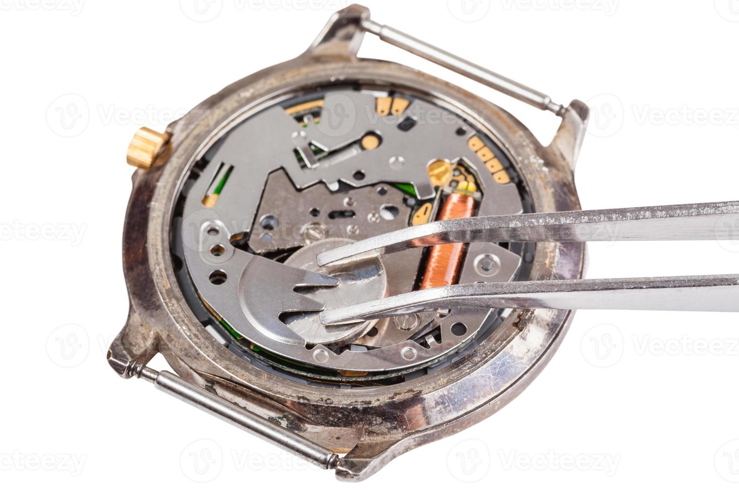 replacing battery in quartz watch isolated photo