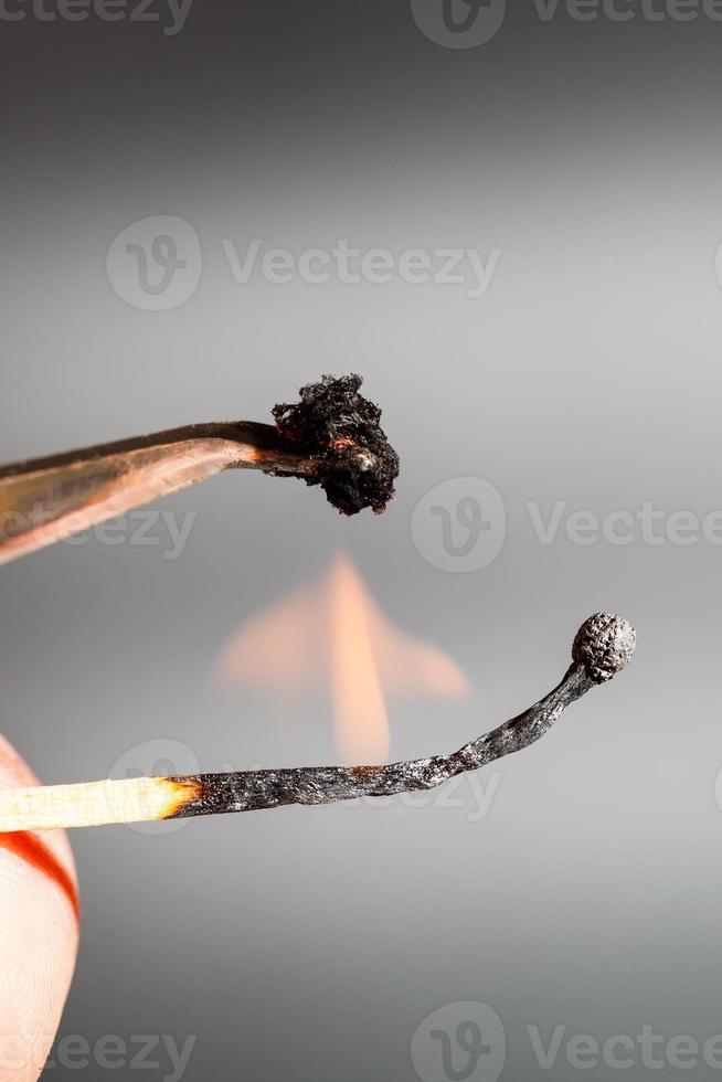 match flame ignites silk textile sample photo