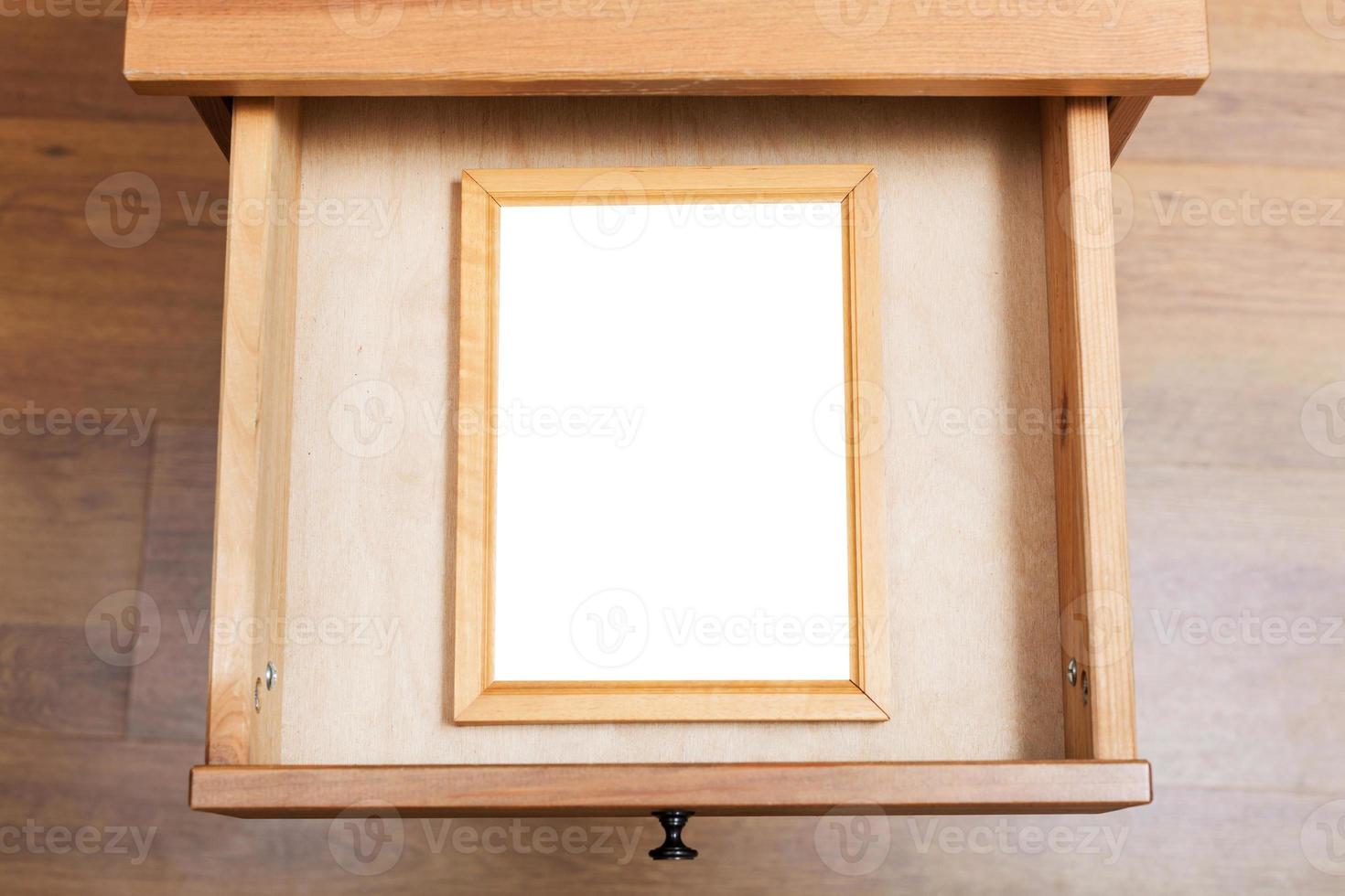 simple picture frame in open drawer photo