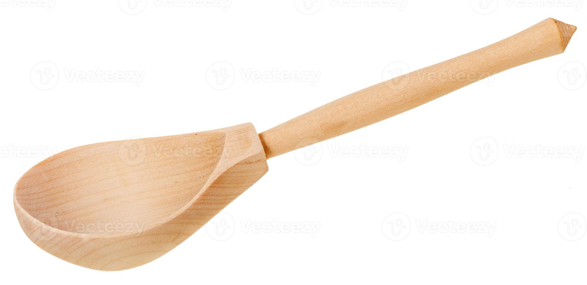 simple wooden spoon isolated on white photo