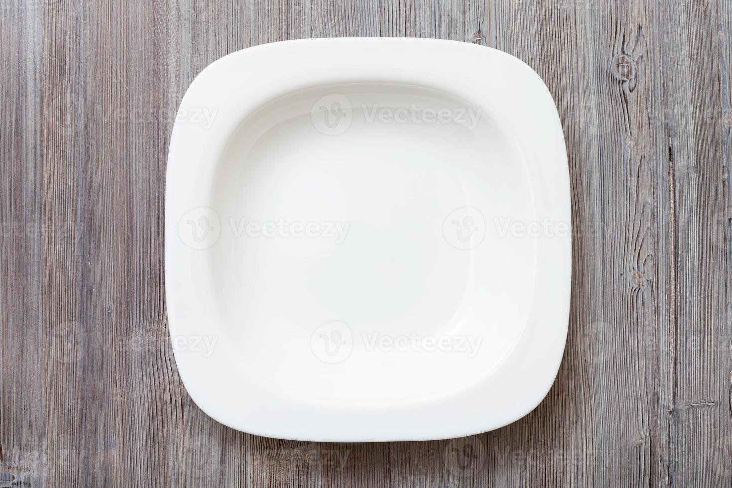 above view of white bowl on gray brown table photo