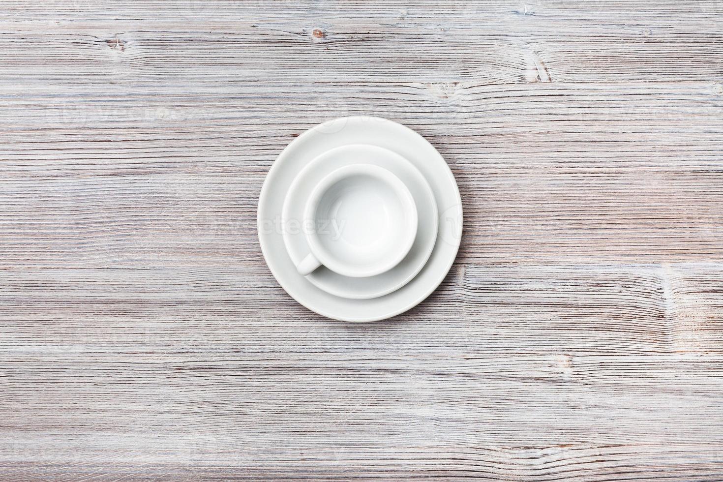 above view of cup with saucers on gray brown table photo