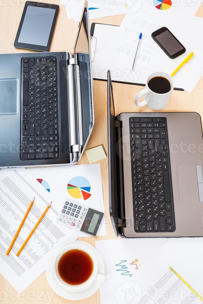 top view of table with tools in modern office photo