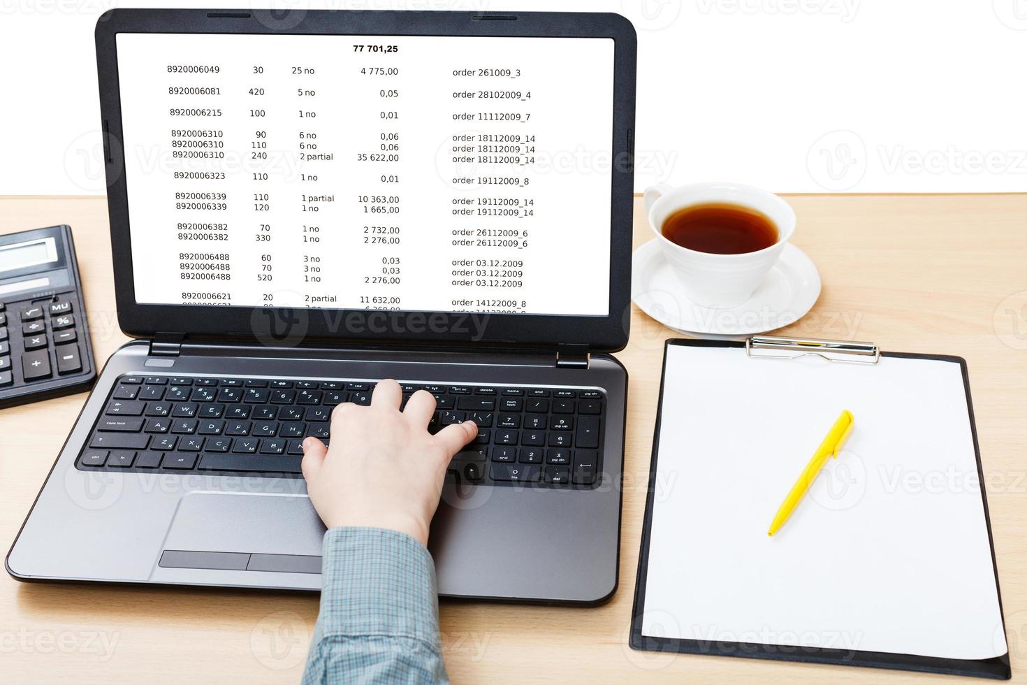 laptop with data on screen on office table photo