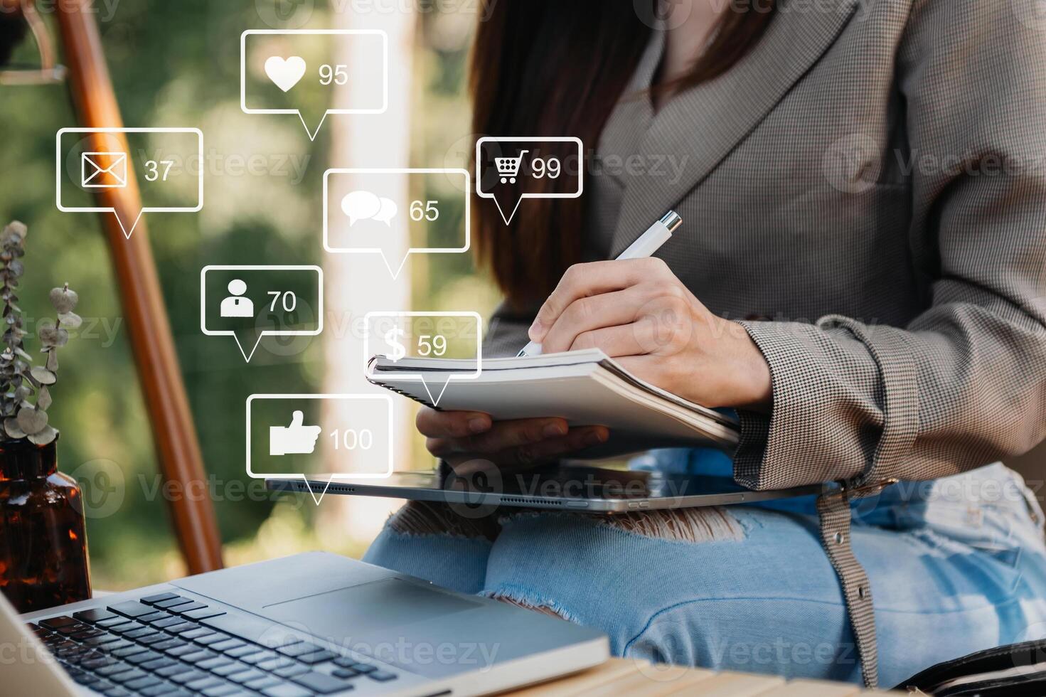 Social media and Marketing virtual icons screen concept.close up of businesswoman typing keyboard with laptop computer photo