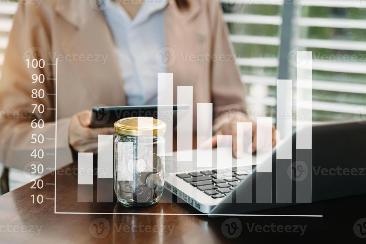 woman accountant working on desk using mobile phone and calculator concept finance and accounting photo