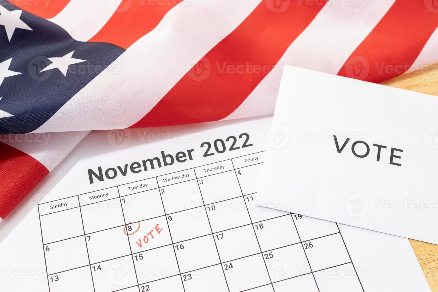Midterm election Vote Day concept. November 8 2022 calendar marked in red and USA flag photo