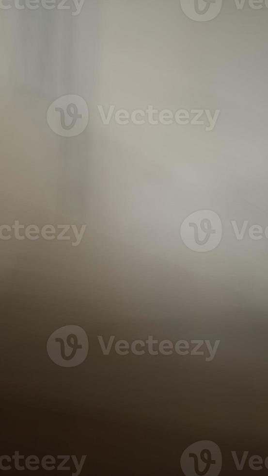 Abstract blur background with brown gray, black, white and earth tones. photo
