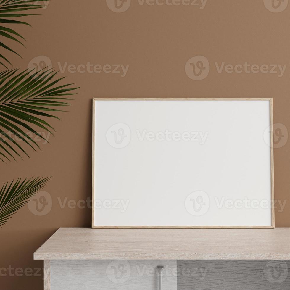 Minimalist front view horizontal wooden photo or poster frame mockup leaning against wall on table with plant. 3d rendering.