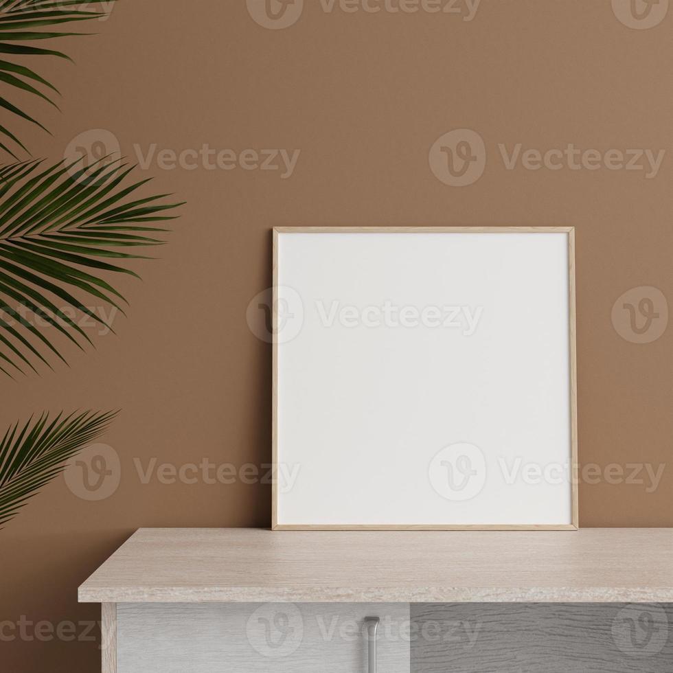 Minimalist front view square wooden photo or poster frame mockup leaning against wall on table with plant. 3d rendering.