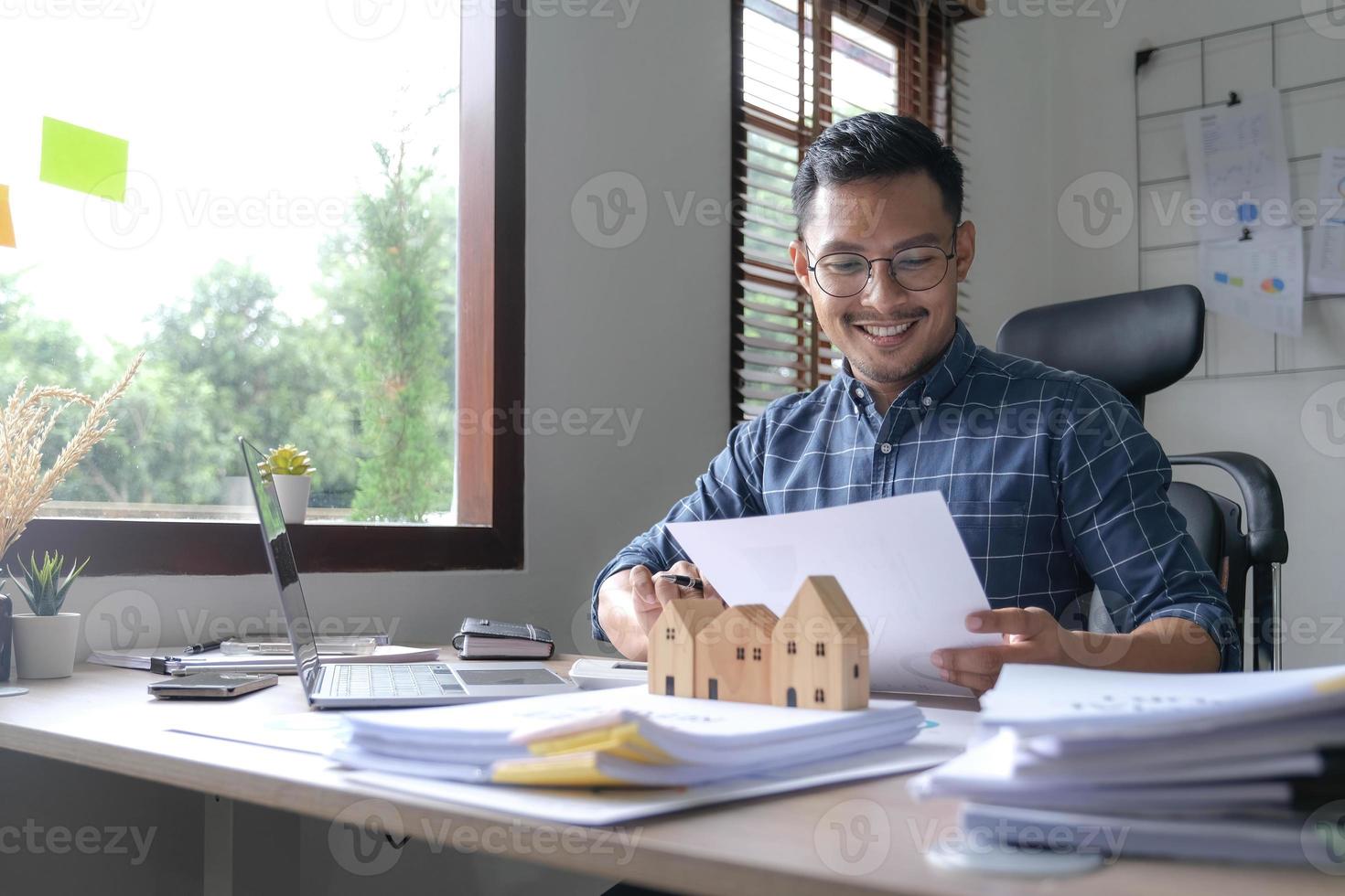businessman hand using calculator and working with laptop calculate about finance accounting at coffeeshop outdor.finance accounting concept photo