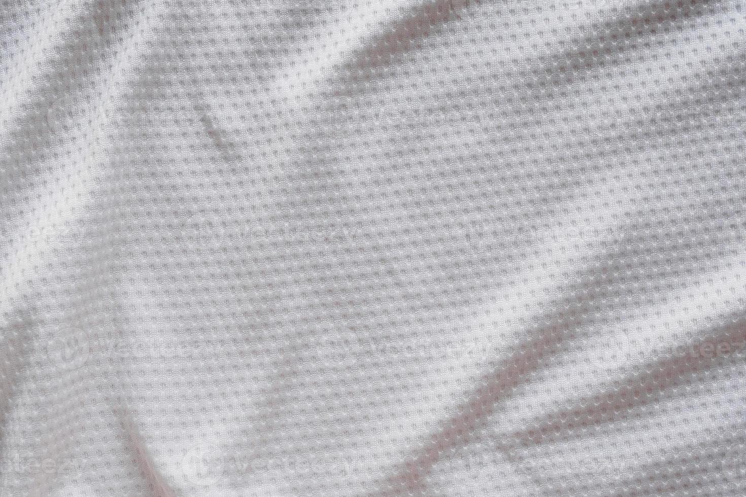 White fabric sport clothing football jersey with air mesh texture background photo