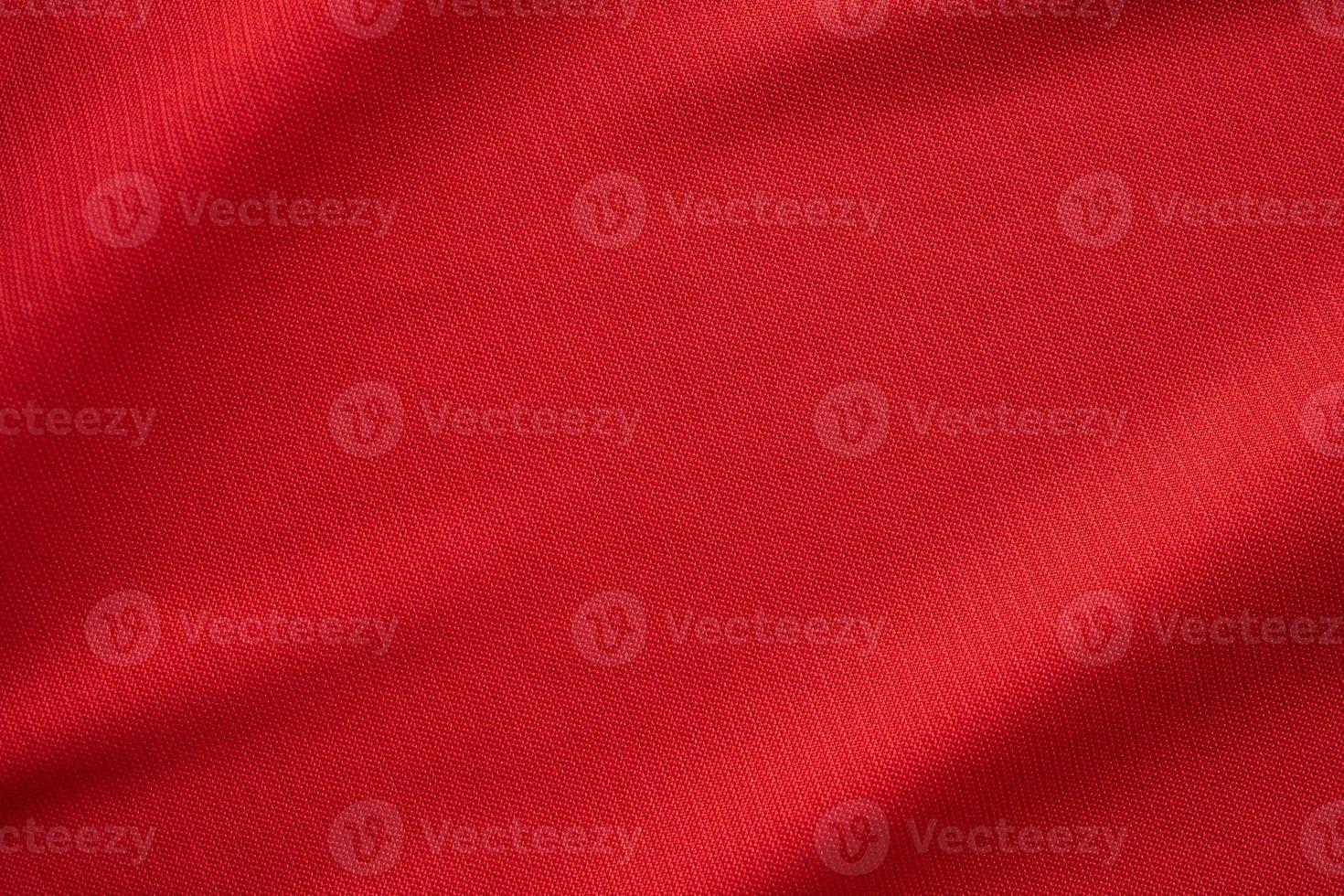 Red sports clothing fabric football jersey texture close up photo