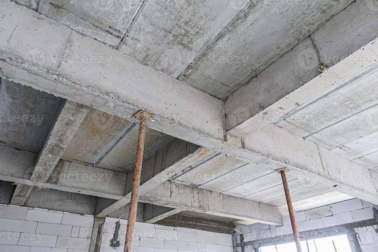 building under construction with iron steel support concrete beams photo
