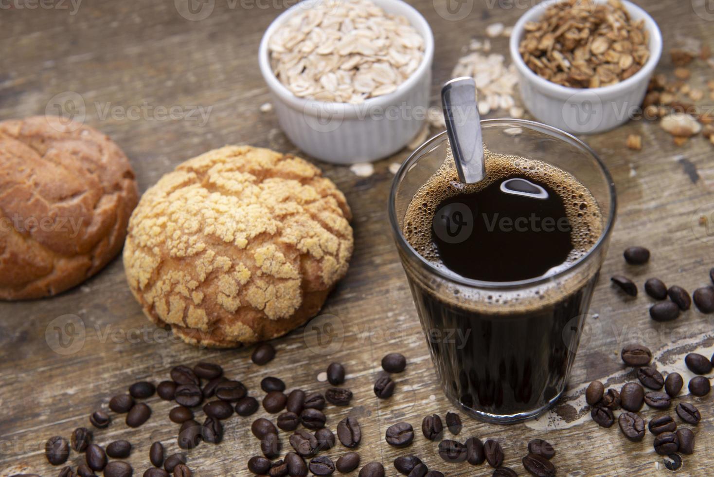 Brazilian traditional black coffee with french bread photo