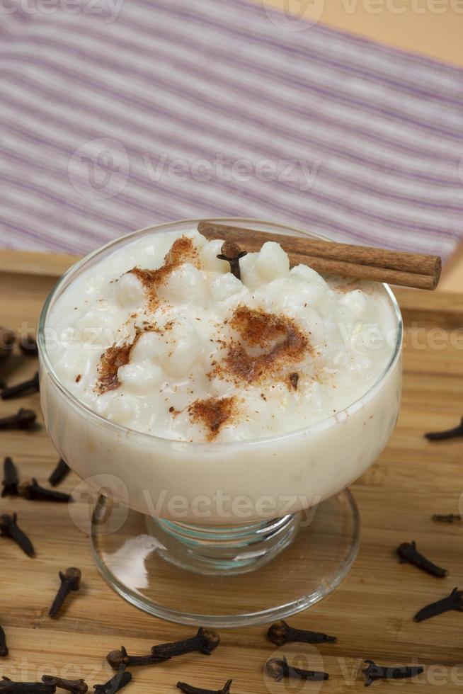 bowl of hominy Canjica on a wooden tray, photo